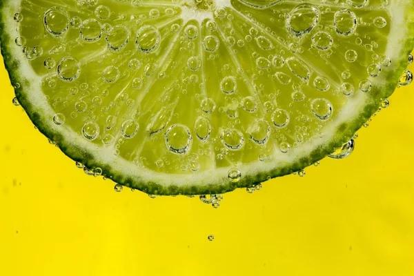 Lime in the bubbles — Stock Photo, Image