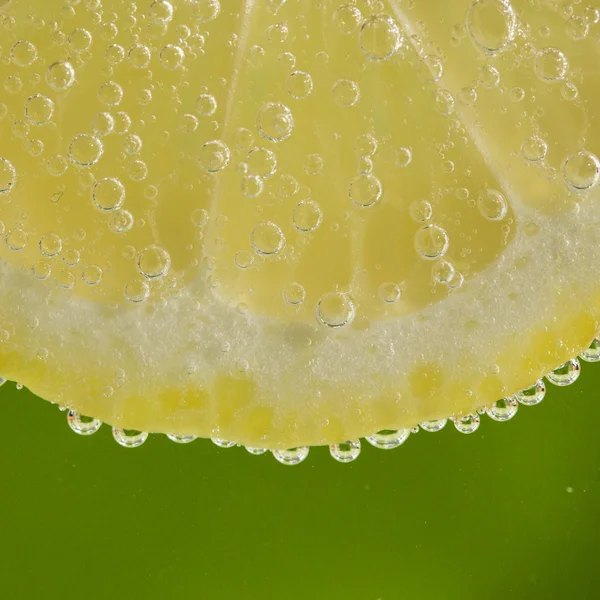 Lemon in the bubbles — Stock Photo, Image