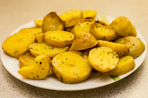 Fried slices of potatoe — Stock Photo, Image
