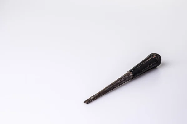 Old black screwdriver on white background — Stock Photo, Image