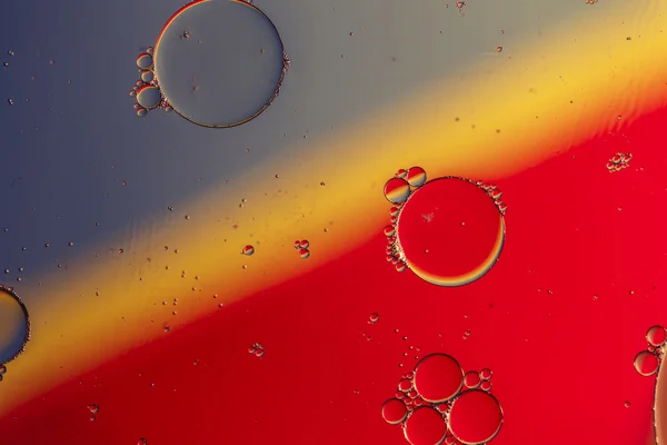 Oil drops on a water surface — Stock Photo, Image