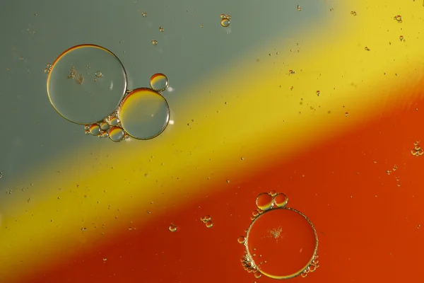 Oil drops on a water surface — Stock Photo, Image