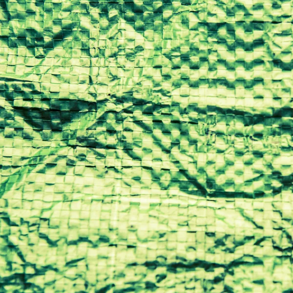 Zelený plastový sáček textury, makro, pozadí — Stock fotografie
