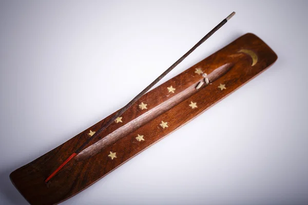 Incense stick on a wooden support on a white background — Stock Photo, Image