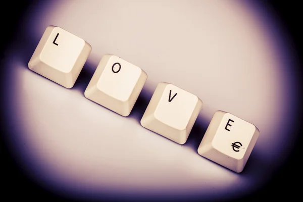 Text love formed with computer keyboard keys on white background — Stock Photo, Image