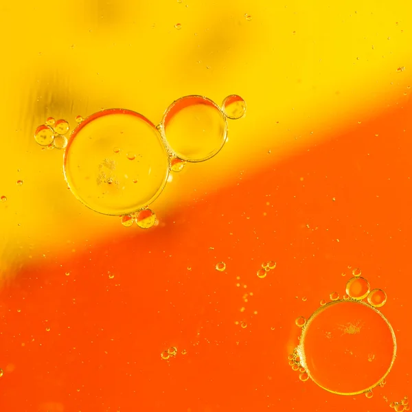 Oil drops on a water surface — Stock Photo, Image