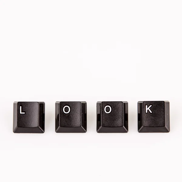 Palabra de aspecto escrito con botones de ordenador negro sobre blanco —  Fotos de Stock