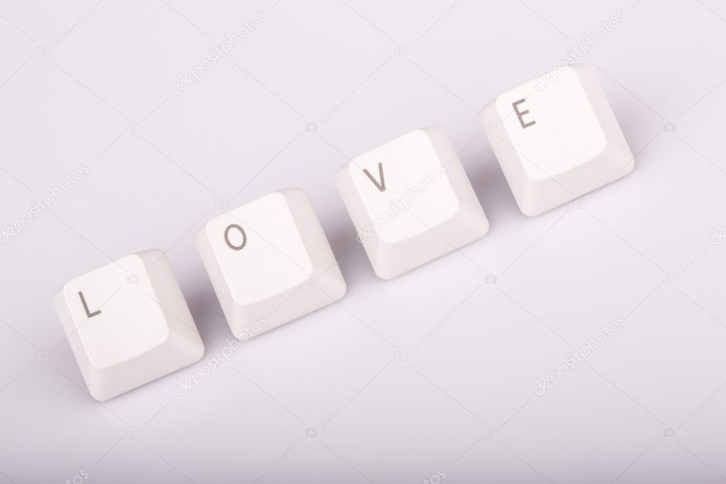text love formed with computer keyboard keys on white background