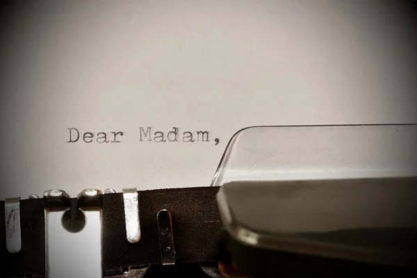 Text Dear madam typed on old typewriter — Stock Photo, Image