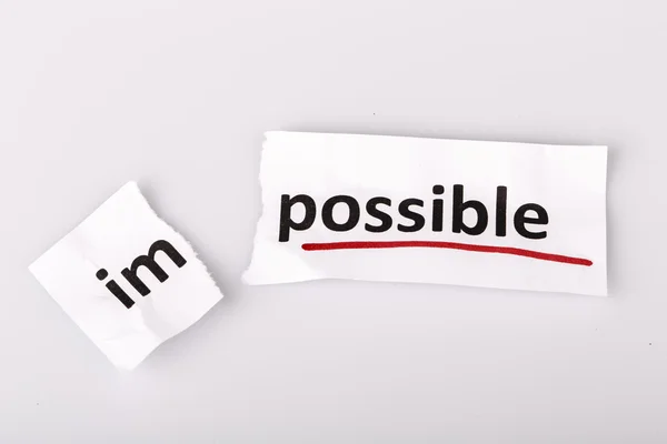 The word impossible changed to possible on torn paper — Stock Photo, Image