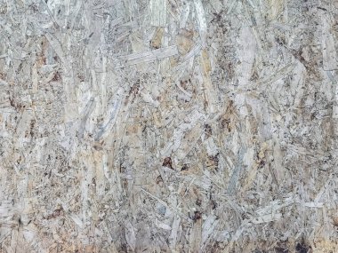 Arka plan için eski sıkıştırılmış doğal bagaz dokusu kullanımı. Malzeme olarak kullanılan bagaj kontrplak veya bagaj parçacık tahtasının (Plain) dokusu ve arka planı. Ezilmiş ahşap tıraş tabağının yüzeyi