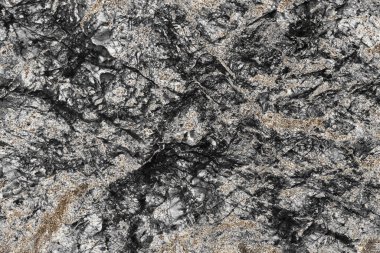 Altın dokusuyla işlenmiş desenli taş arkaplan.