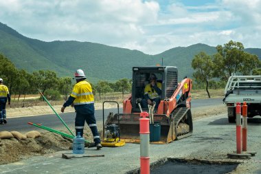 Townsville, Queensland, Australia - May 2022: Heavy machine scoop used in highway road construction