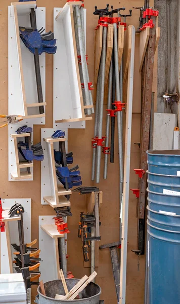 A collection of clamps in a men's tool shed