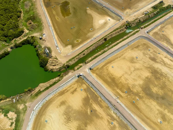 Drone aerial view of a prawn farm currently empty for the winter season. Grasstree Beach Queensland Australia.