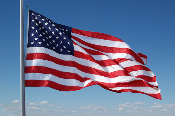 American flag flying Royalty Free Stock Photos