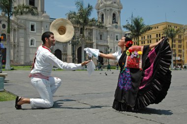 Marinera dancers in front of the cathedral in Lima Peru clipart
