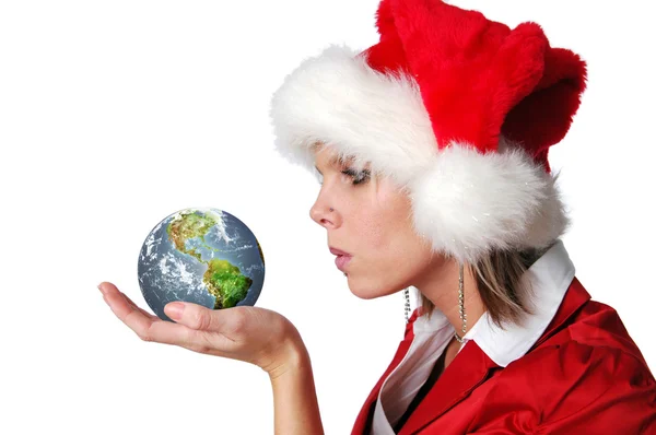Santa meisje blazen wensen op aarde — Stockfoto