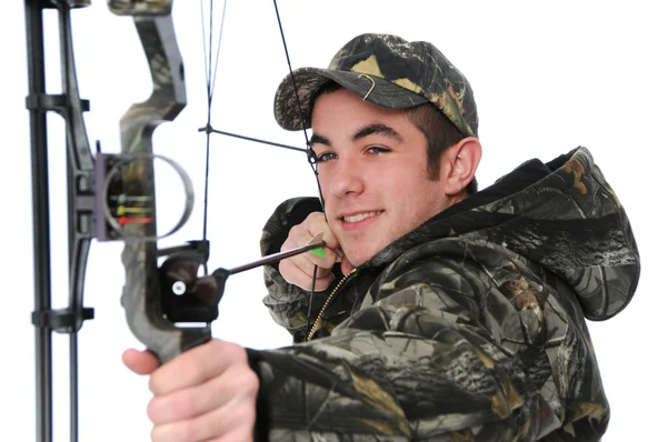 Young hunter with bow aiming — Stock Photo, Image