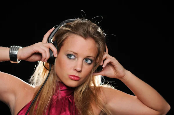 Gorgeous girl with headphones enjoying music — Stock Photo, Image