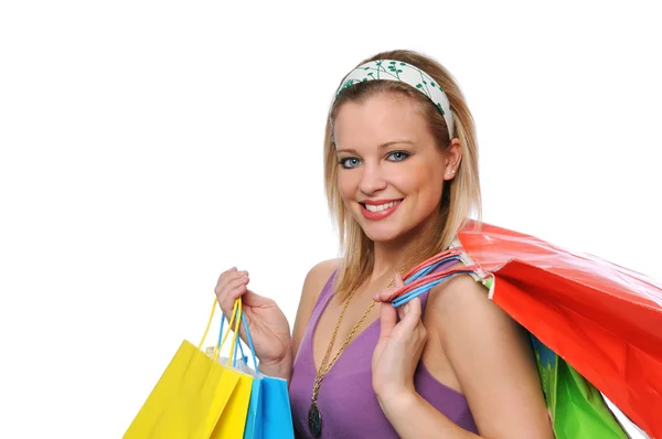 Beautitul lachende tiener meisje met shopping tassen — Stockfoto