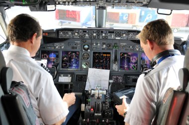 Pilots in the cockpit during a commertial flight
