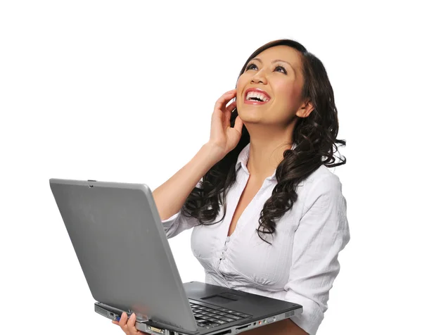 Young asian woman laughing and holding a laptop — Stock Photo, Image