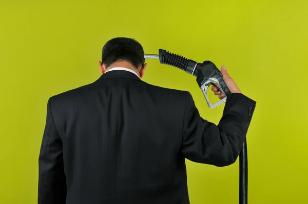 Businessman committing suicide with a gas nuzzle — Stock Photo, Image