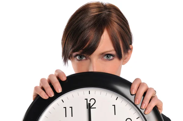 Businesswoman holding a clock — Stock Photo, Image