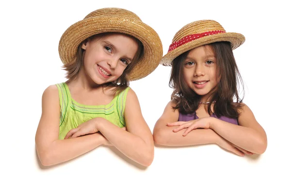 Portret van kleine meisjes houden van een teken — Stockfoto