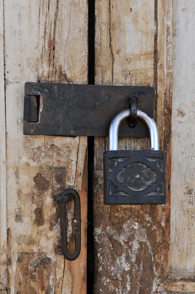 Old grungy door with vintage lock — Stock Photo, Image