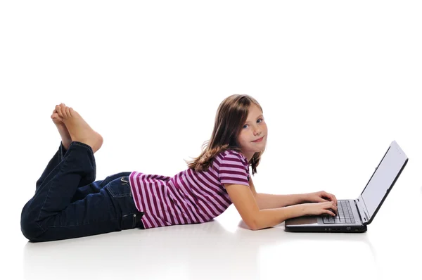 Little girl with a laptop Royalty Free Stock Photos