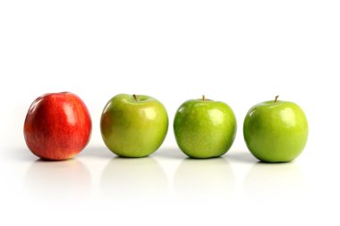 Red apple among green apples