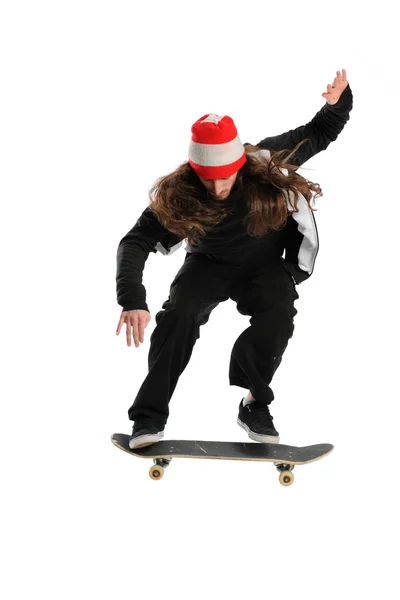 Young man jumping on a skateboard — Stok fotoğraf