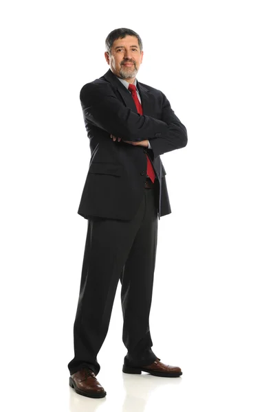 Homme d'affaires mature debout avec les bras croisés — Photo