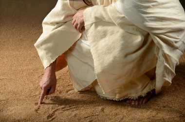 Jesus Writing won the sand