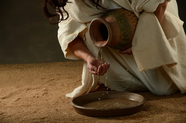 Jesus pouring water — Stock Photo, Image