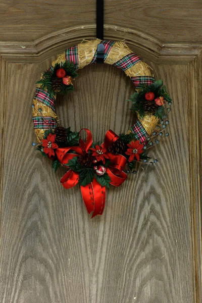Christmas Decoration by an old door — Stock Photo, Image