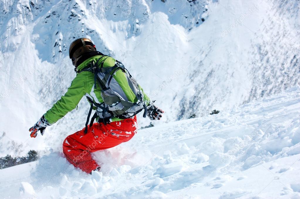 Snowboarder in deep powder
