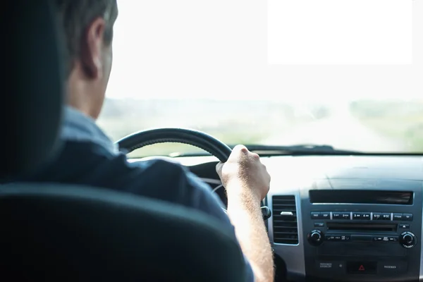 Hands of a driver on wheel — Stock Photo, Image