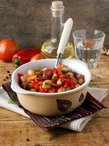 Appetizing dish in the plate on wooden table — Stock Photo, Image