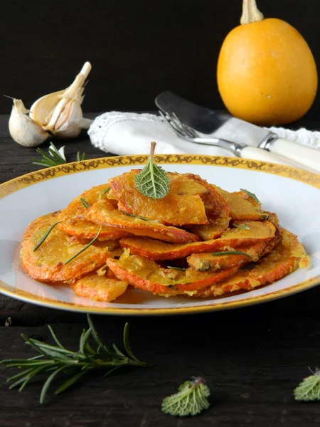 Appetizing dish in the plate on wooden table — Stock Photo, Image