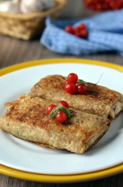 Pancakes with stuffing and berries Royalty Free Stock Images