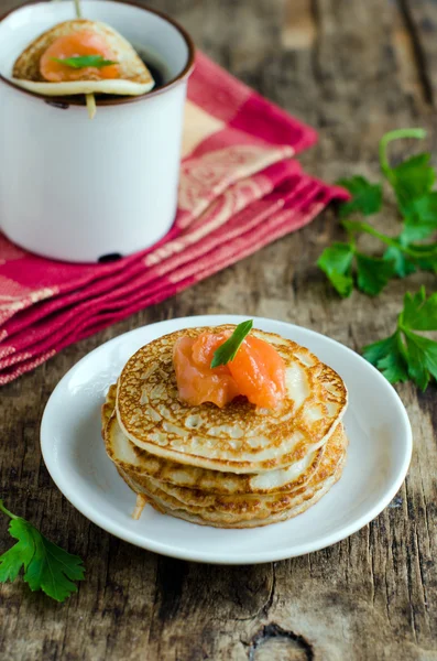 Pancakes with salted salmon — Stock Photo, Image