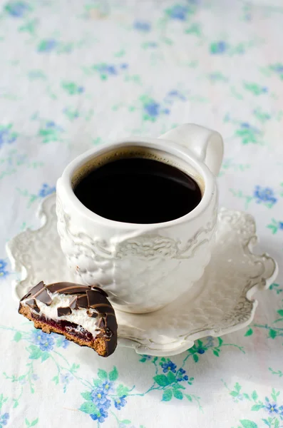 A Cup of coffee with chocolate candy — Stock Photo, Image