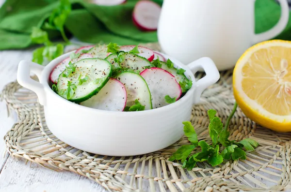 Salad from fresh cucumbers and radish — Stock Photo, Image