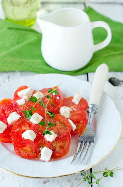 Fresh salad from the black tomatoes and cheese — Stock Photo, Image