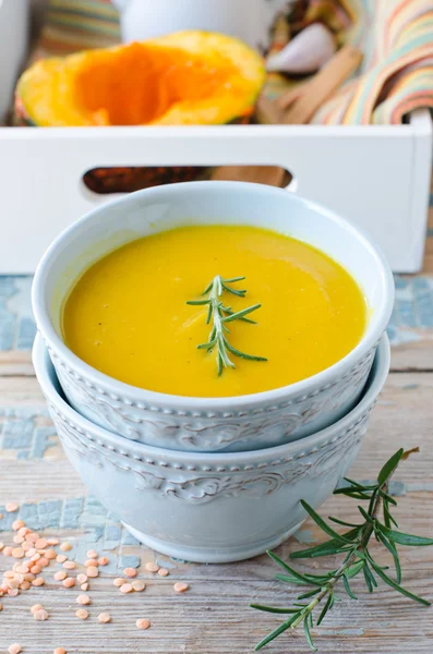 Pumpkin cream soup with lentils and rosemary — Stock Photo, Image