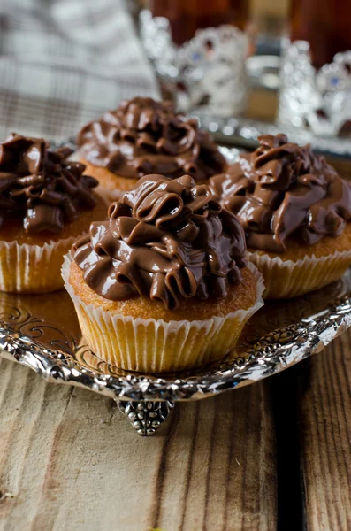 Cupcakes with chocolate cream — Stock Photo, Image