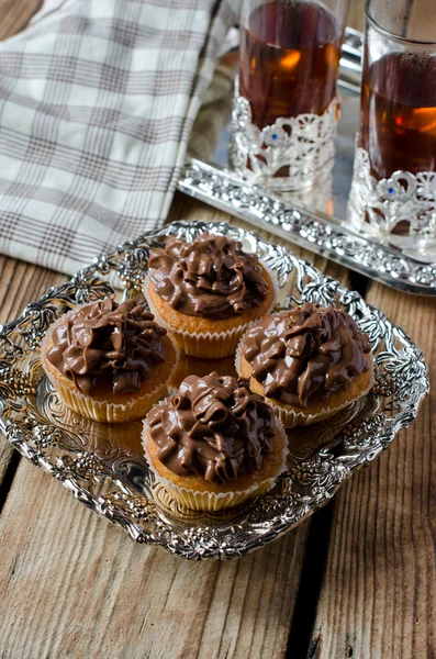 Cupcakes with chocolate cream — Stock Photo, Image